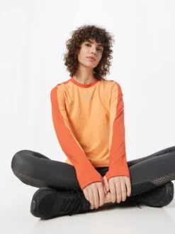 Nike Hauts à Manches Longues T-shirt Fonctionnel Femme Orange Clair / Orange Foncé -ADIDAS PERFORMANCE Soldes 29598bae23398c918a87d4bb0bf0ac31